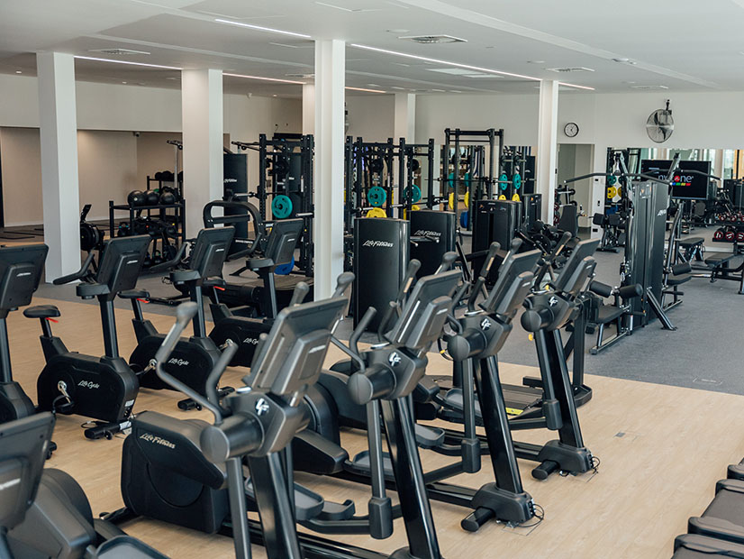 Exercise bikes and weights inside the Fawkner Leisure Centre gym.